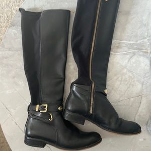 Black leather Michael Kors riding boots with gold details